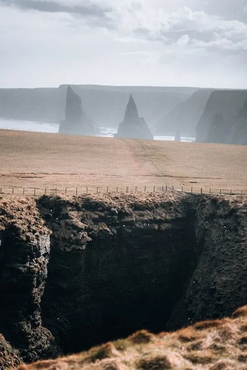Looking across the clifftop meadows to the Duncansby stacks
