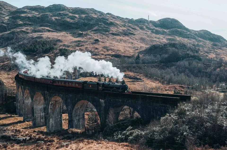 The Jacobite Steam Train steaming across the Glenfinnan Viaduct